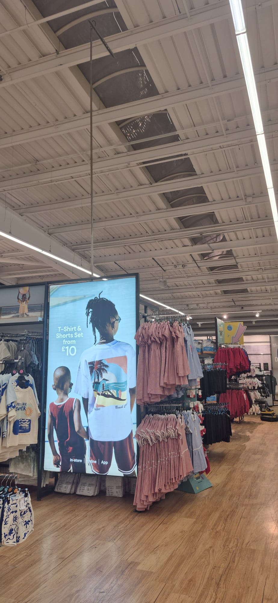 Overhead lighting in the George clothing area
