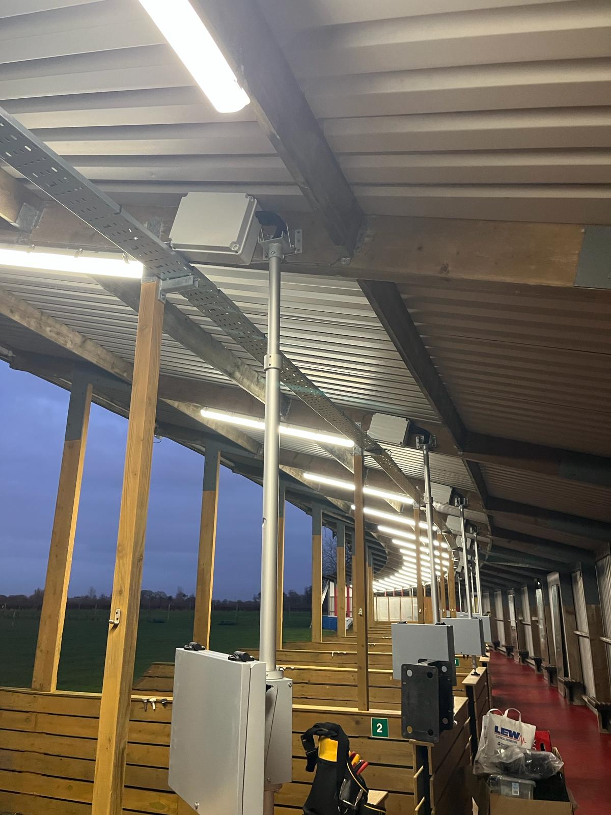 Bay equipment supports, cabling and overhead lighting