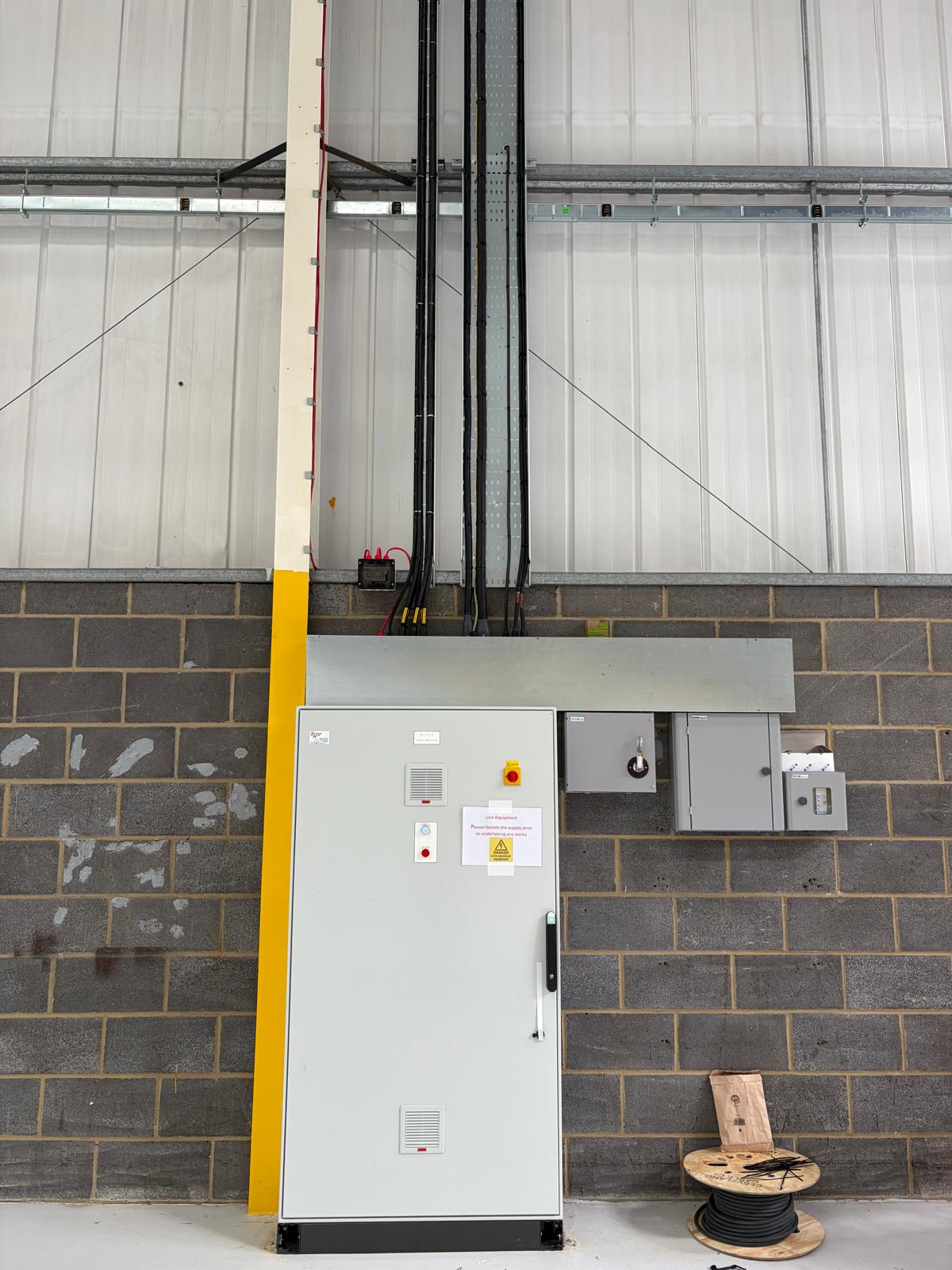 Control panel and vertical cable containment