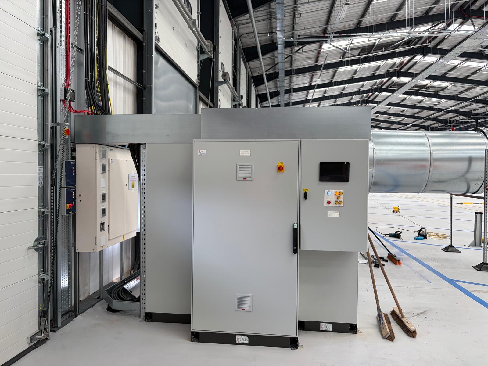 Control panel installation beside warehouse ventilation plant